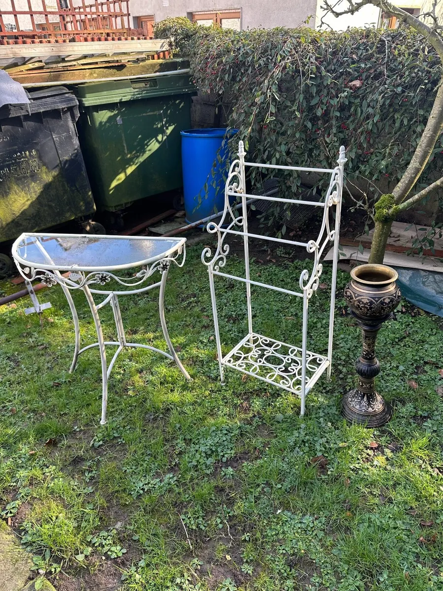 Glass table and bronze flower pot stand