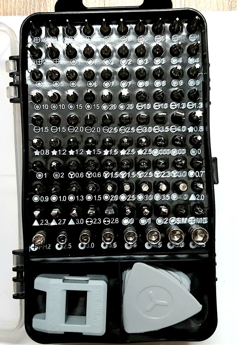 Box of screwdriver bits and phone accessories - Image 2