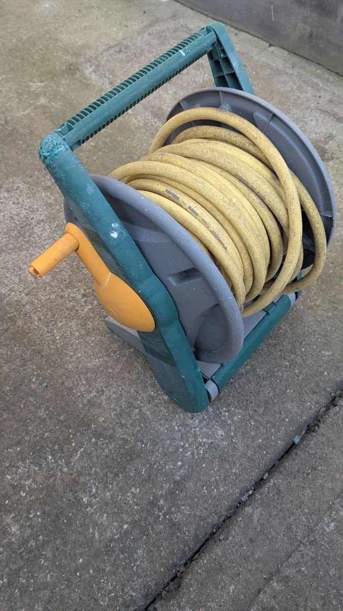 Garden hose with holder and attachment - Image 1