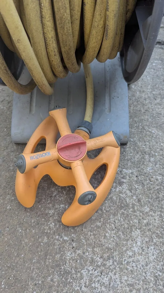 Garden hose with holder and attachment - Image 2