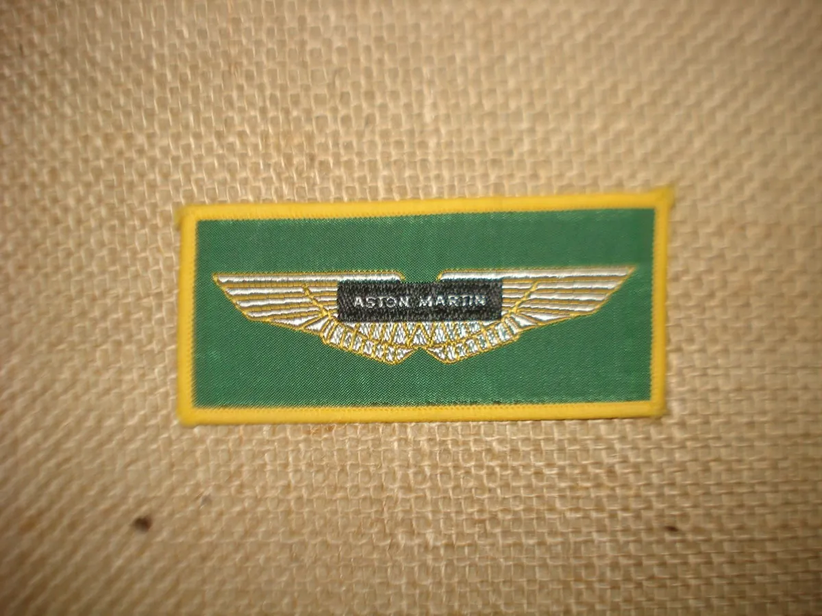 ASTON MARTIN LAGONA II FRAMED 1976 POSTER & BADGE, - Image 4