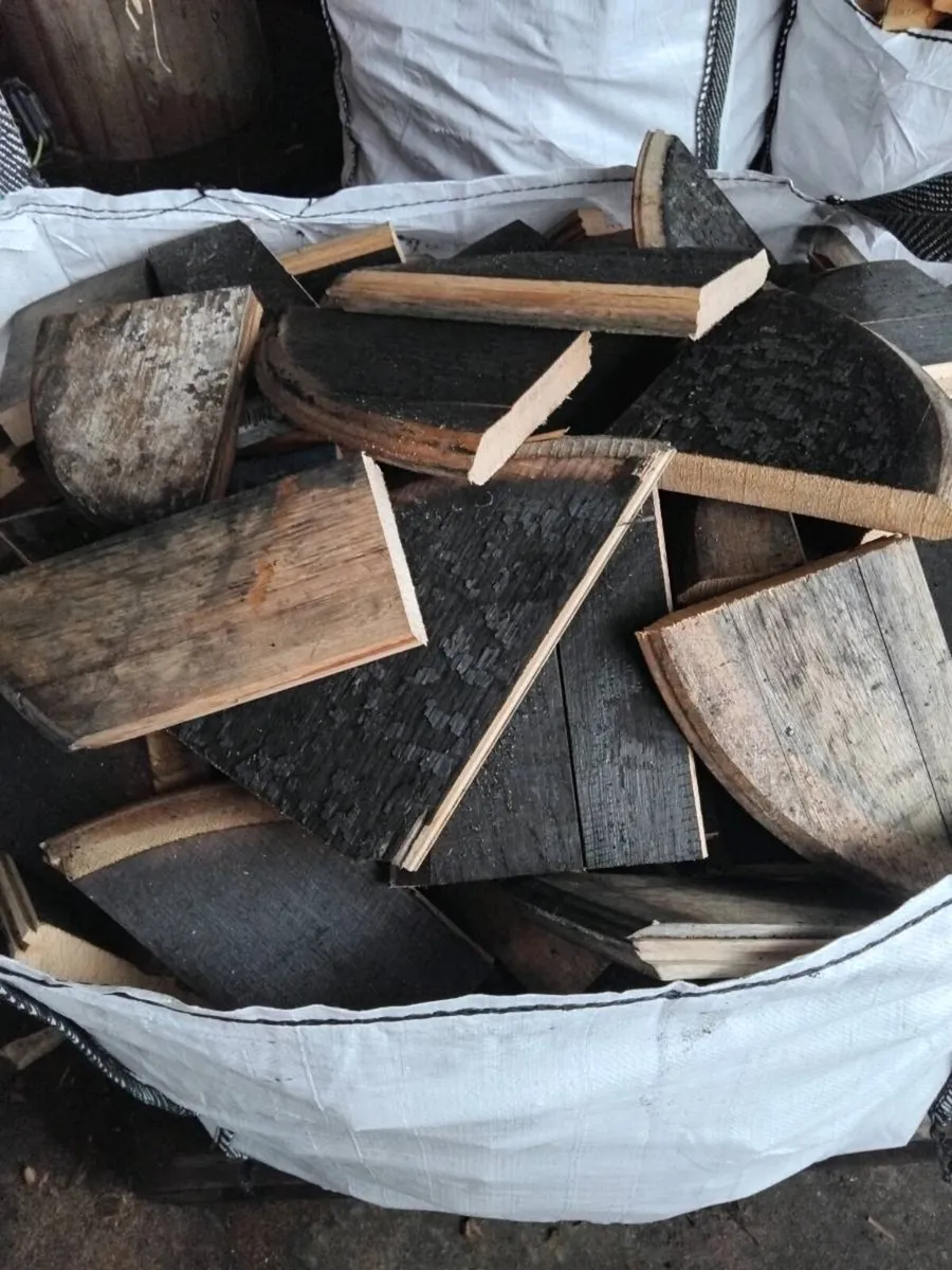 Bulk bags of seasoned oak firewood.