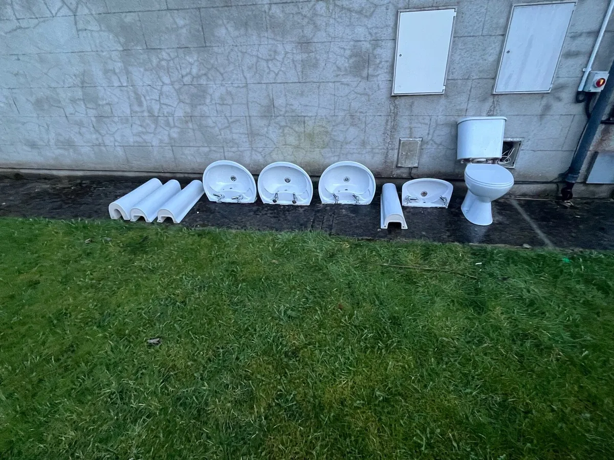 Bathroom hand basins and toilet - Image 1