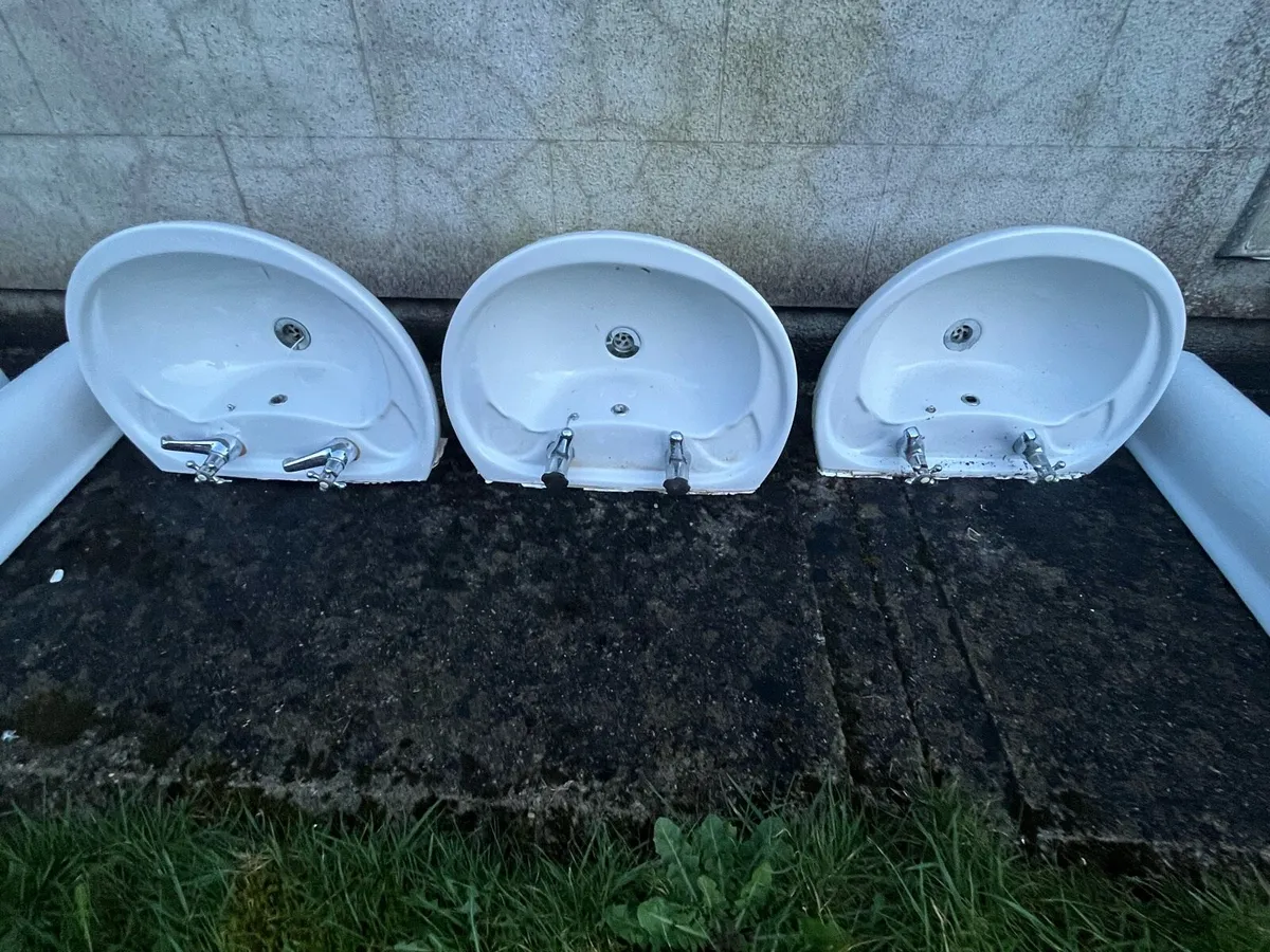 Bathroom hand basins and toilet - Image 3