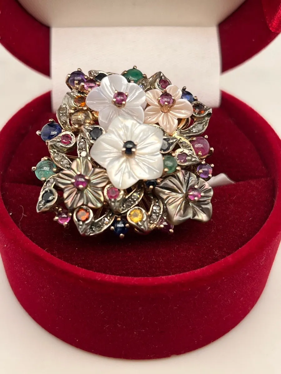9k rose gold multi stone bouquet ring with shell. - Image 1