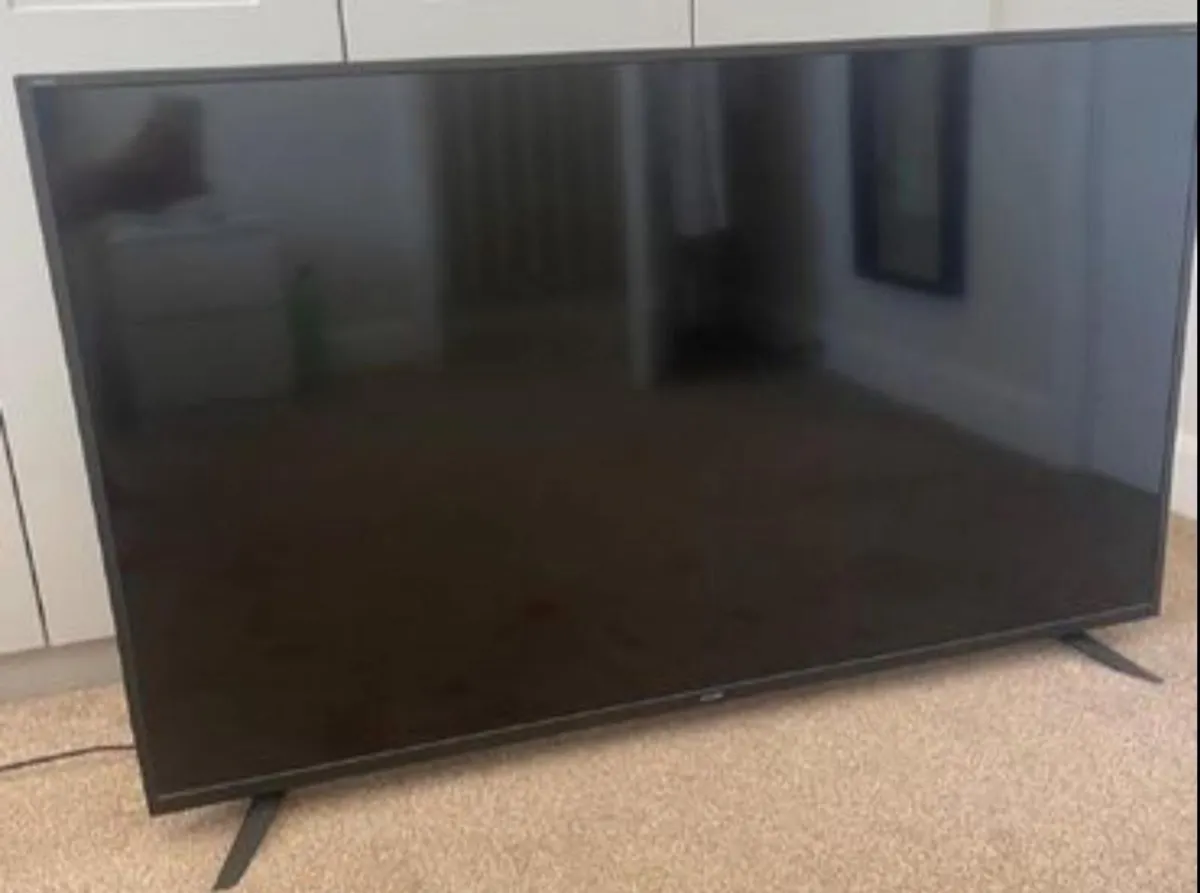 55” 4K Sharp smart tv with soundbar & remote.