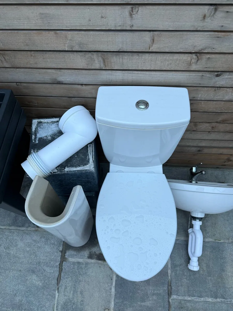 Toilet and a sink - Image 3