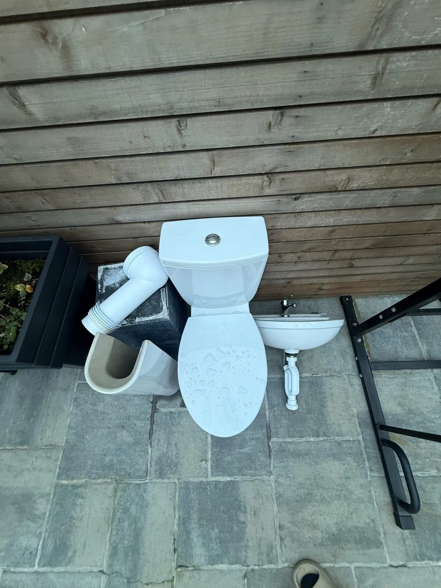 Toilet and a sink - Image 1