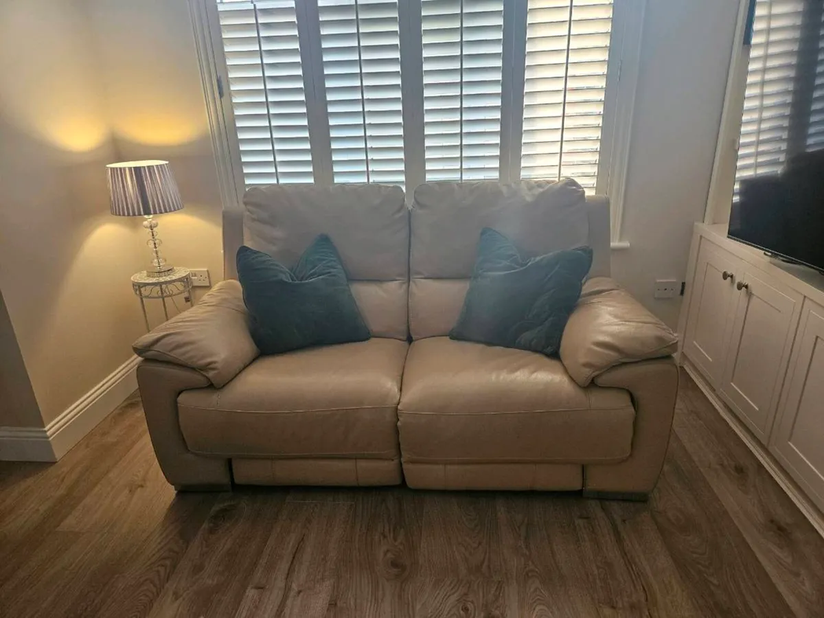 Cream leather couch and foot stool with storage - Image 1