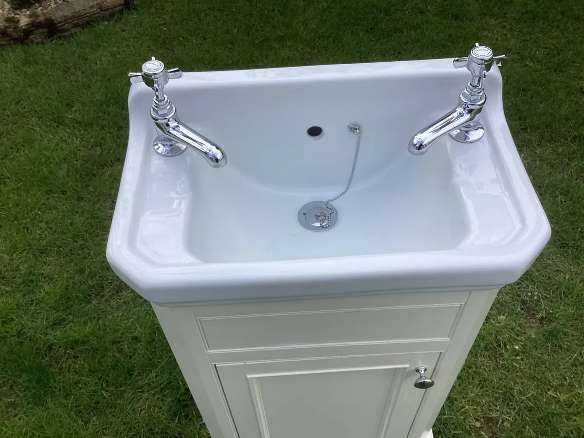 Bathroom cabinet with sink and taps - Image 1