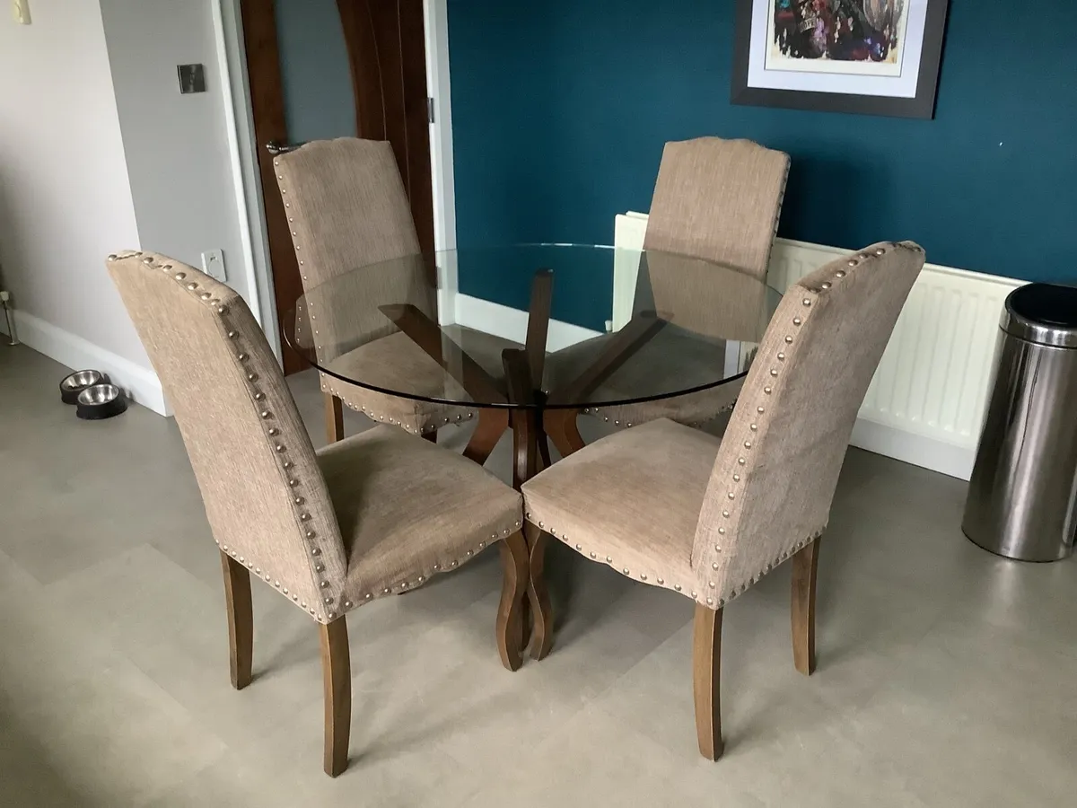 Glass top table and four chairs