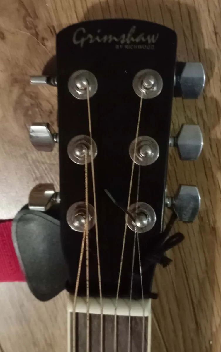 Black acoustic guitar - Image 1