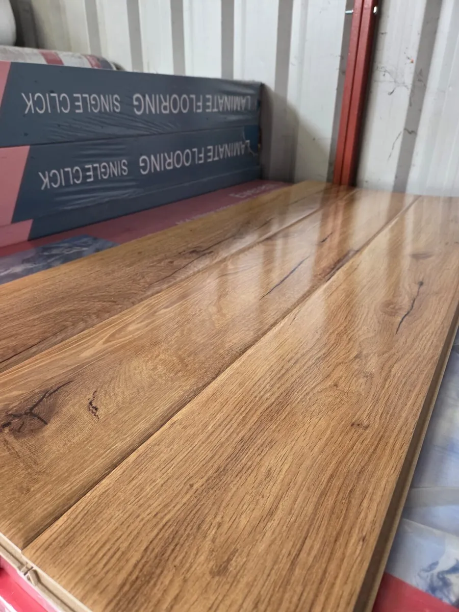New High Gloss 12mm Laminated Flooring - Image 3