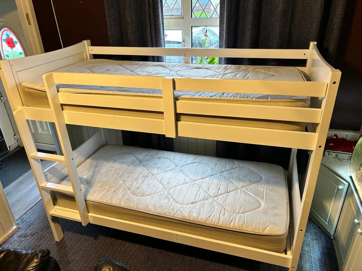 White bunk bed with mattresses - Image 1