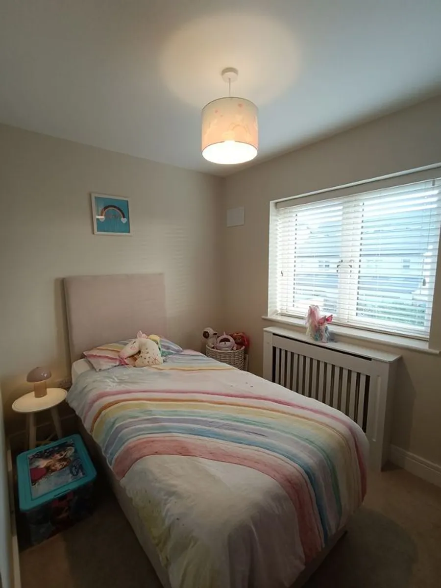 Bed with guest mattress underneath - Image 1