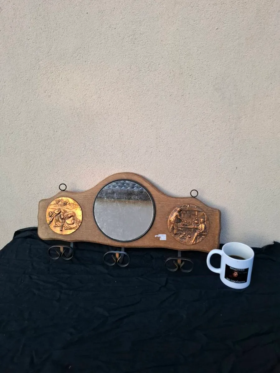 Coat holder with mirror
