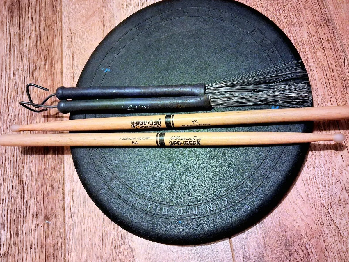 Drum sticks, brushes and pad
