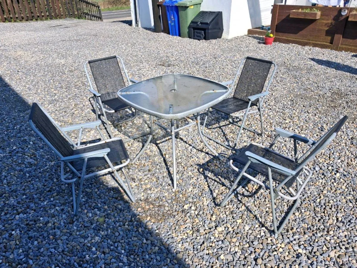 Garden table and chairs. 
In good condition