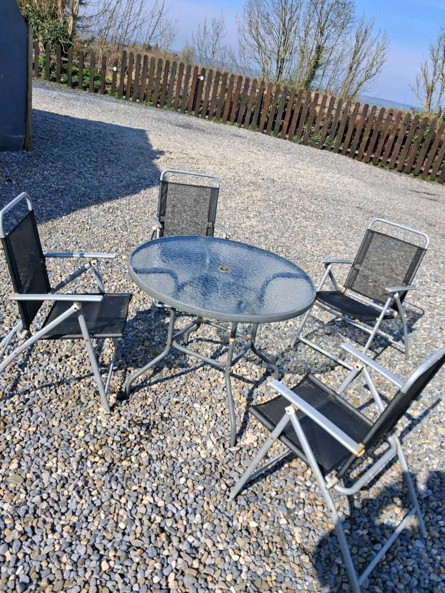 Garden table and chairs. 
In good condition