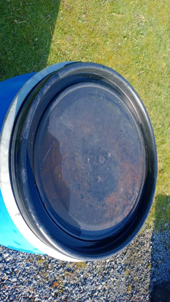 blue plastic barrels. - Image 4