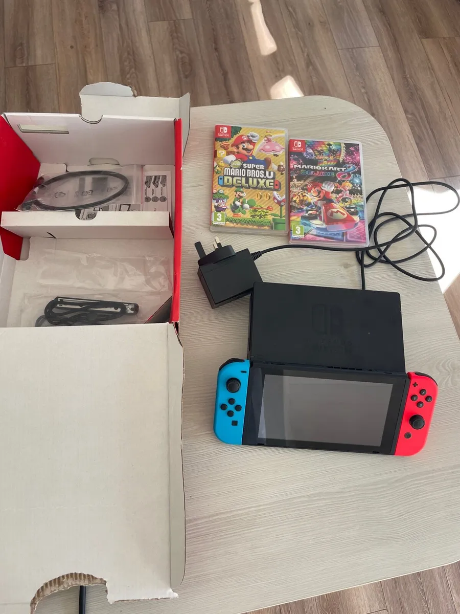 Nintendo switch with Mario kart and Mario bros - Image 1