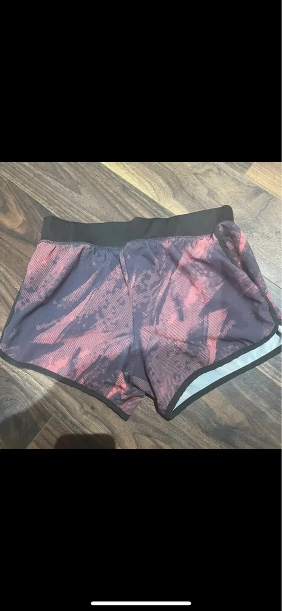 Pink and grey running shorts - Image 1