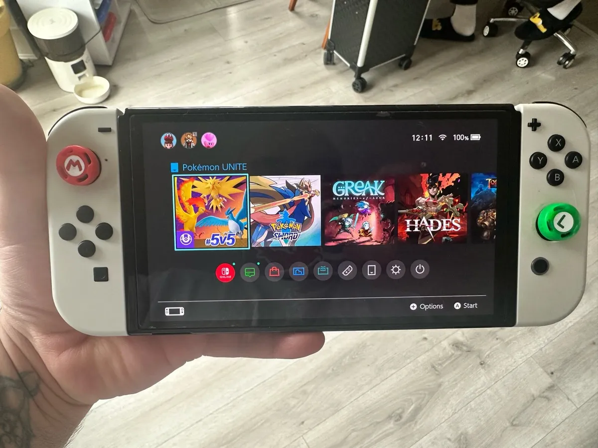 Nintendo Switch Oled + Joystick + Portable Charger - Image 1