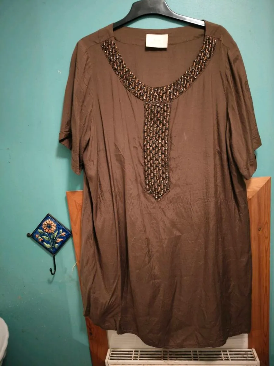 Ann Harvey brown with lovely shine dress.
Width 54 - Image 1