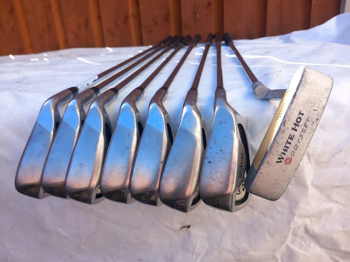 Wilson golf irons and Odyssey golf putter. - Image 1