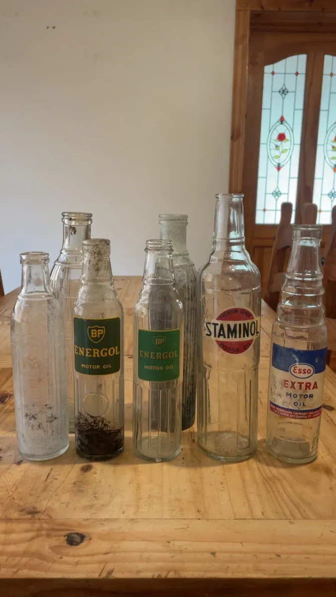 Vintage 7 oil bottles