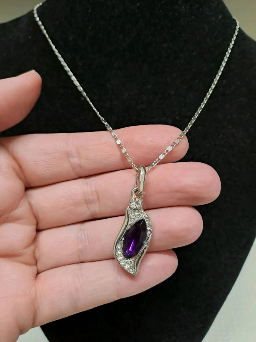 Silver Tone Necklace with Purple Crystal Pendant - Image 1