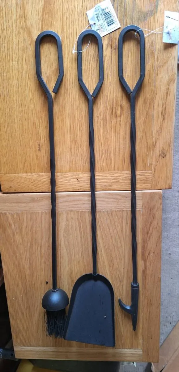 Three long handled fire tools