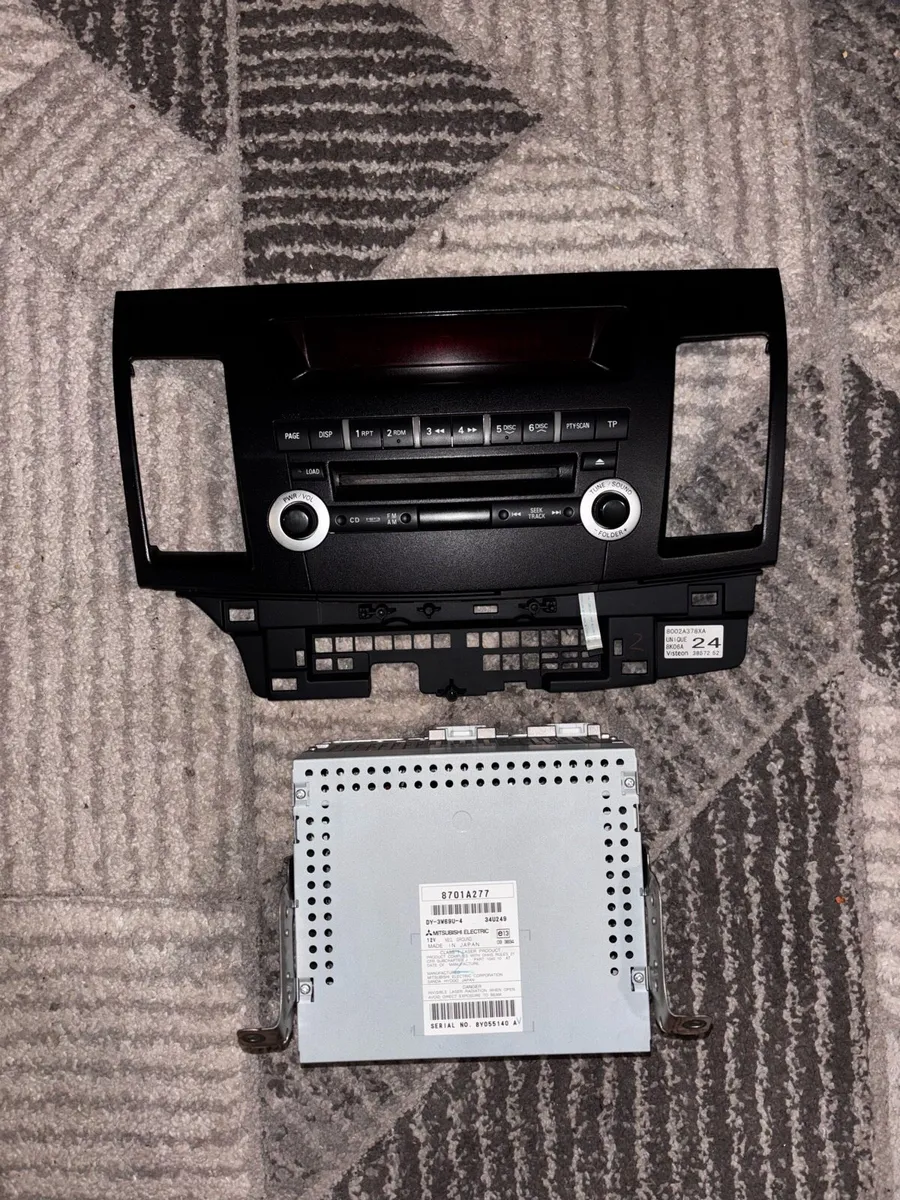 Mitsubishi Lancer stock OEM radio w/ fascia - Image 1