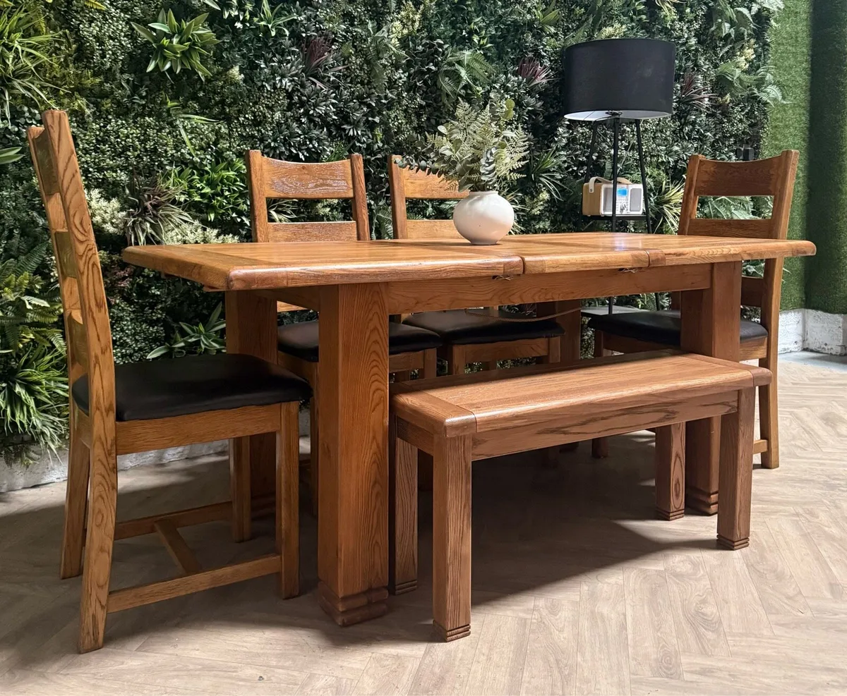 Extending oak kitchen table, 4 chairs & bench - Image 1