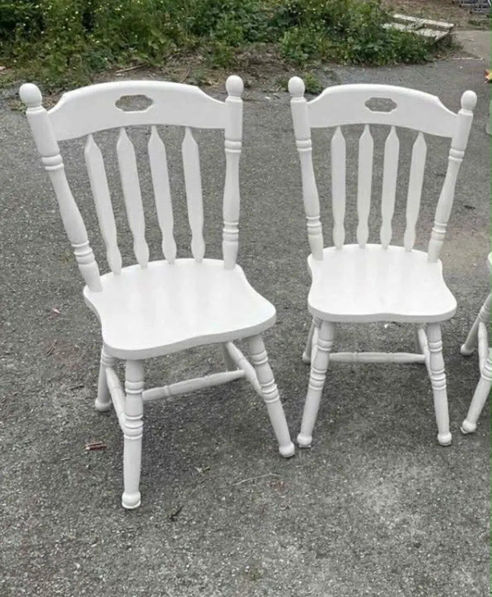 2 wooden white chairs