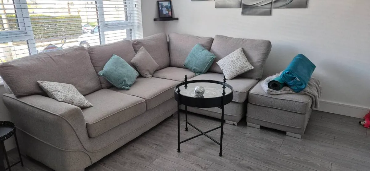 Grey corner sofa with foot poof. - Image 1