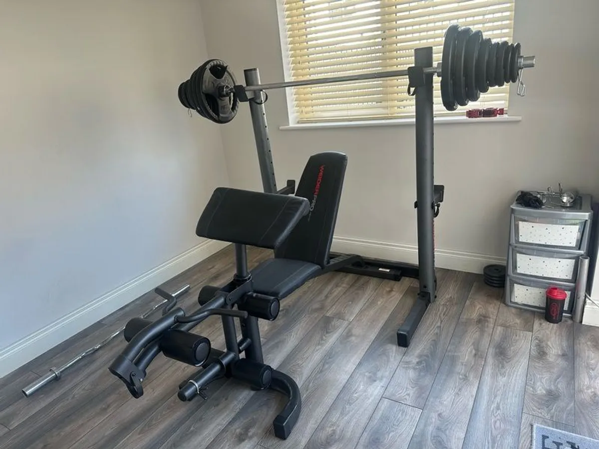 Home Gym Equipment: Adjustable Weider Gym Bench, Olympic bars, and Rubber Weights - Image 1