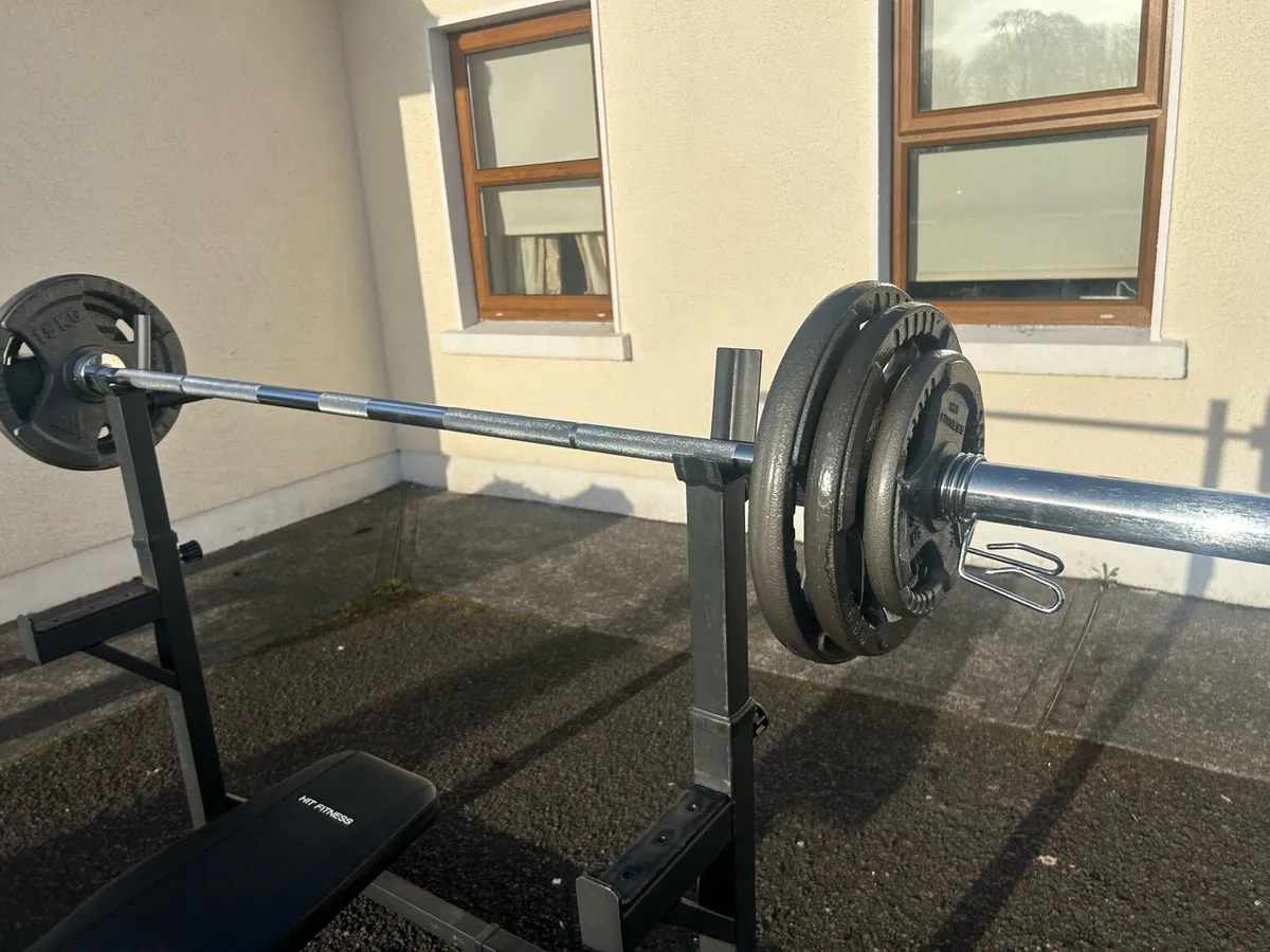 Full weights bench and barbell + extra plates - Image 1