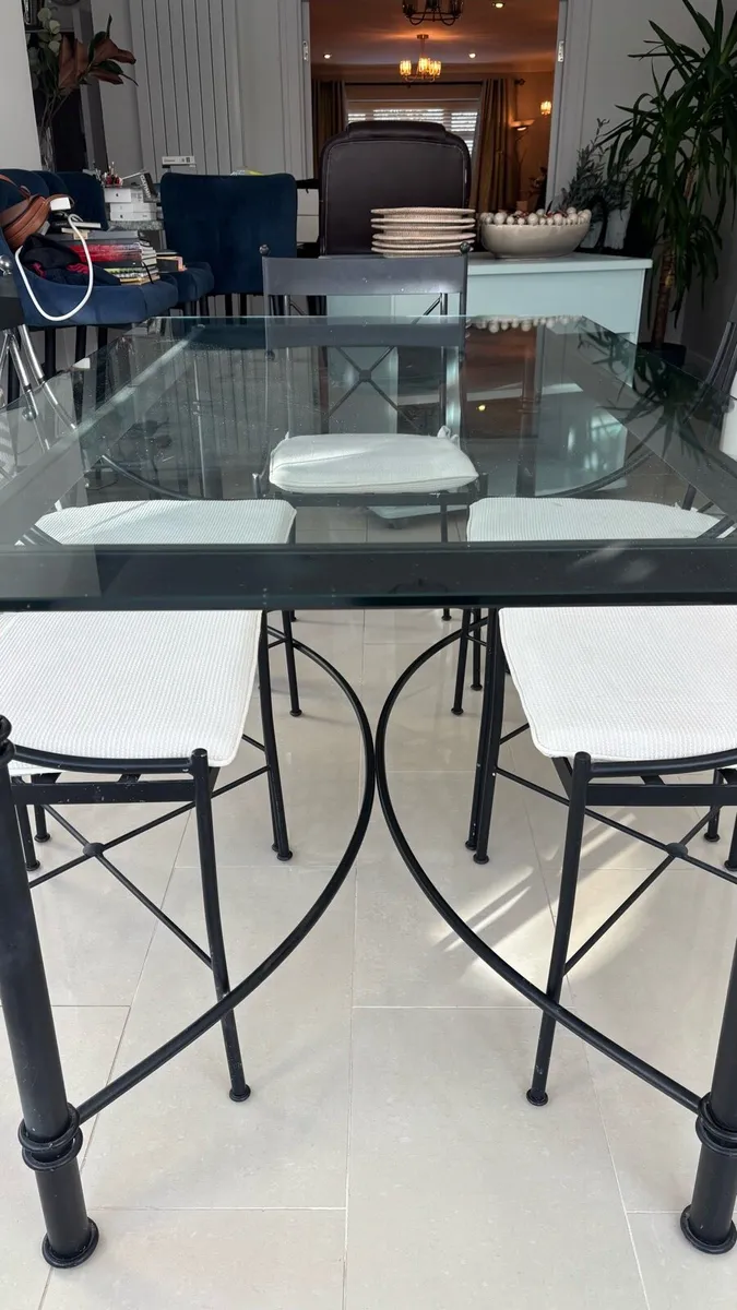 Glass and steel dining table with matching chairs - Image 3
