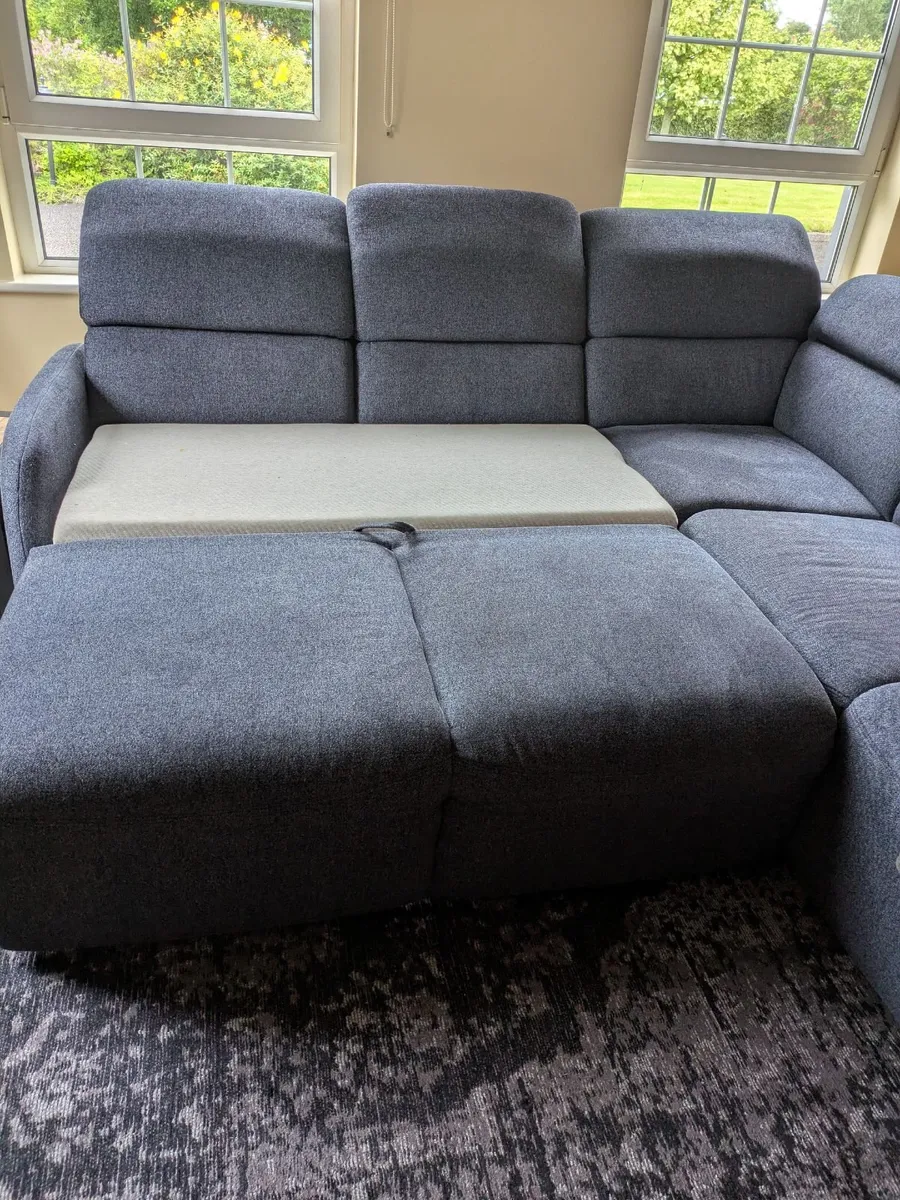 L shape corner couch with pull out bed and storage - Image 4