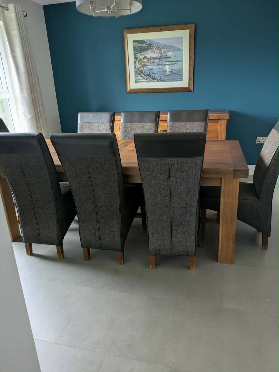 Large oak extendable dining table and 8 chairs - Image 1