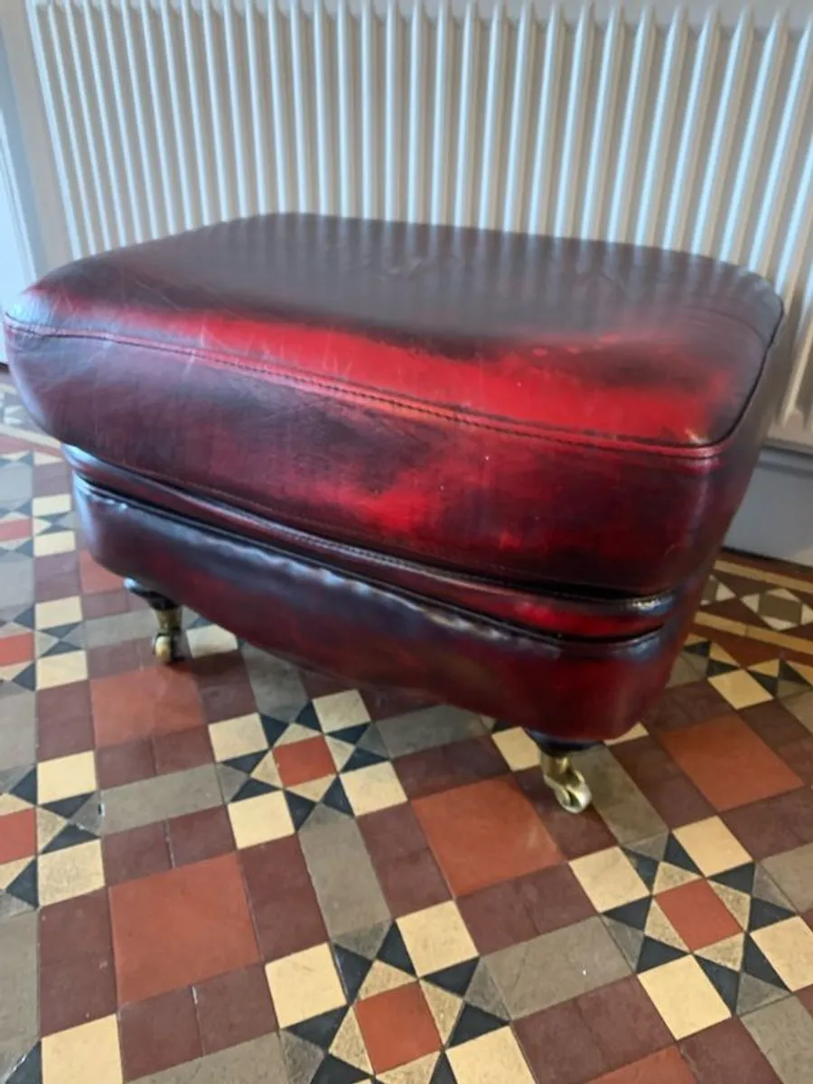 Leather Footstool on brass Castors. - Image 1