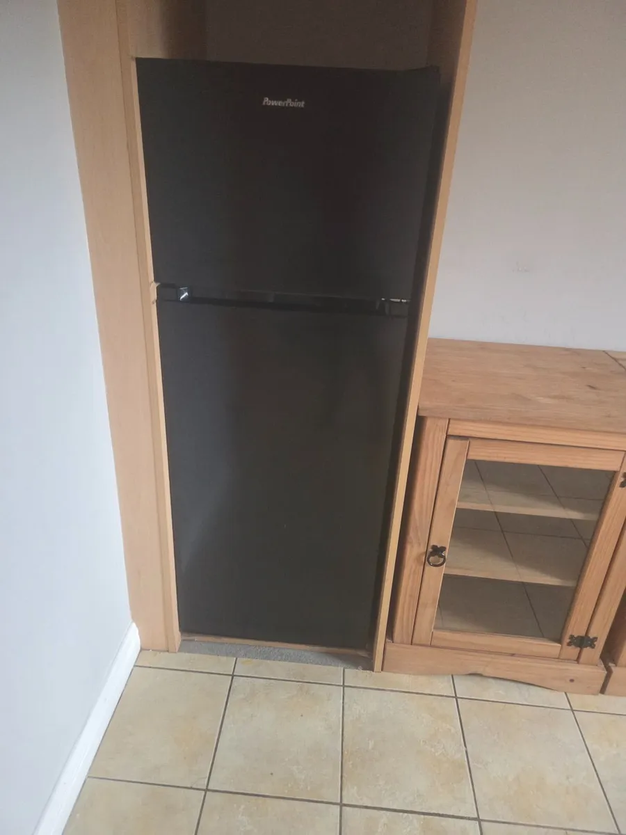 Fridge freezer black in colour