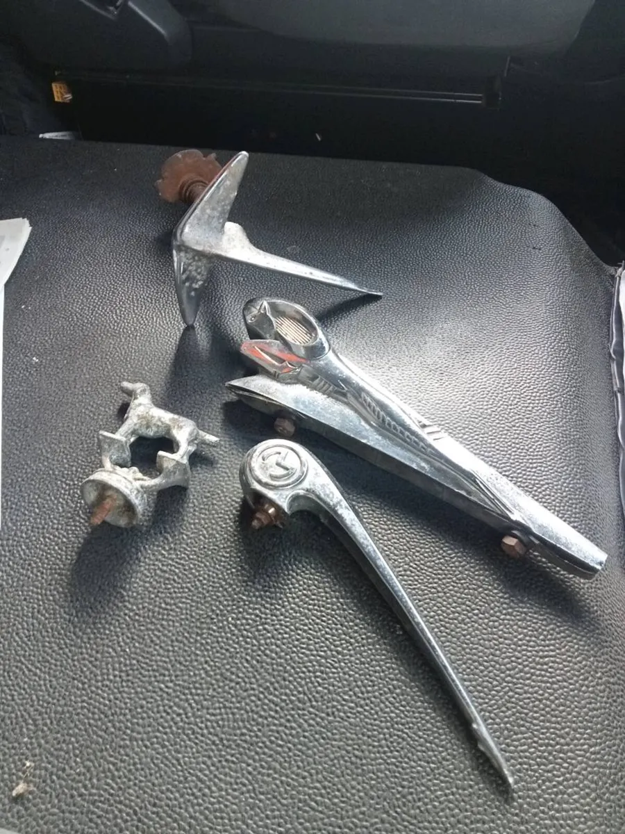 Four old car badges - Image 1