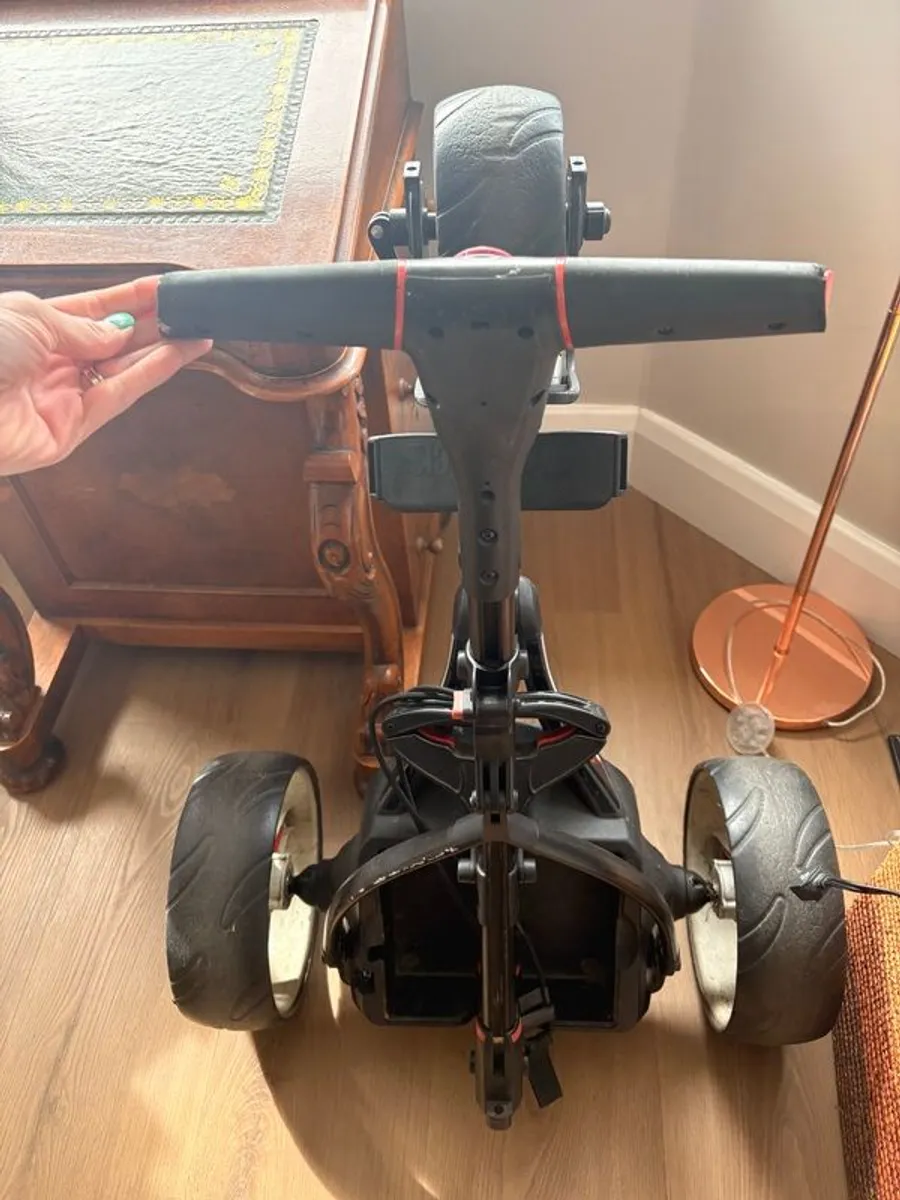 MotoCaddy motorised golf trolley and battery - Image 1