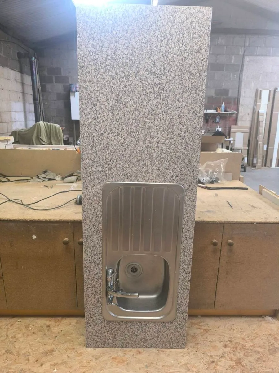 Kitchen sink taps and counter worktop - Image 1