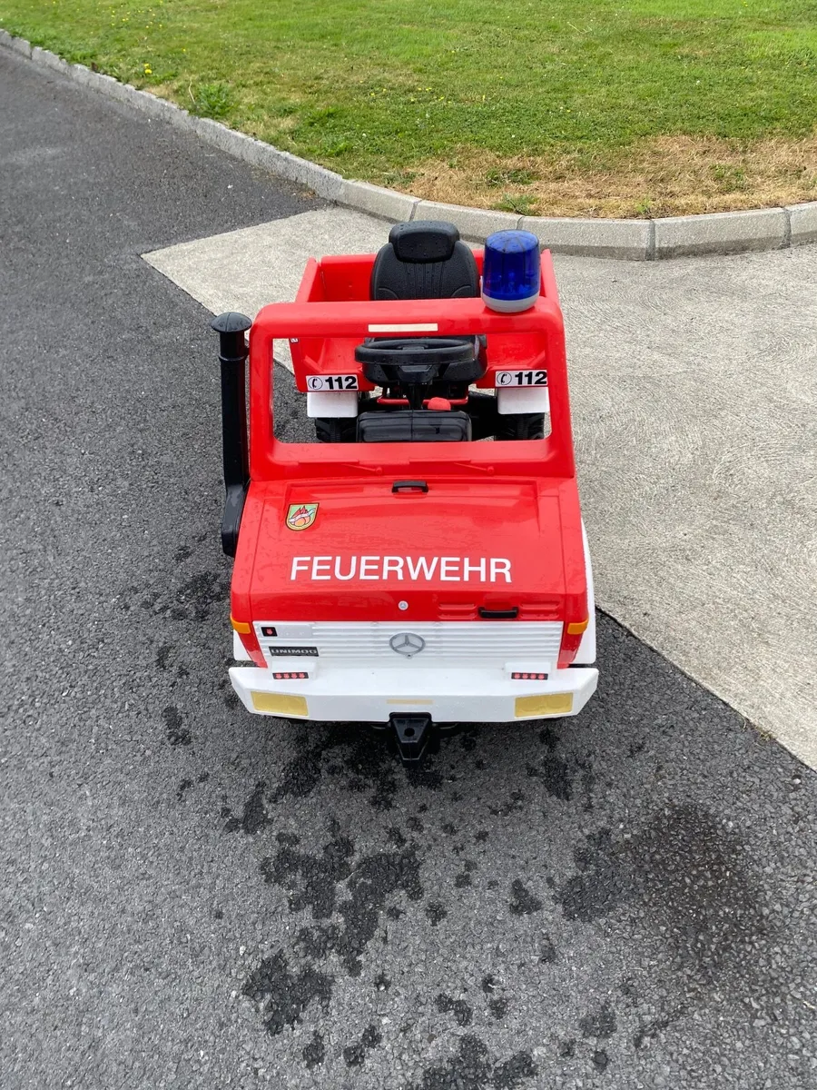 Rolly unimog toy fire engine - Image 1