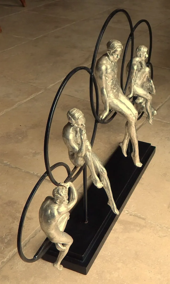 Large Artwork of Male Figurines Inside Metal Rings - Image 2