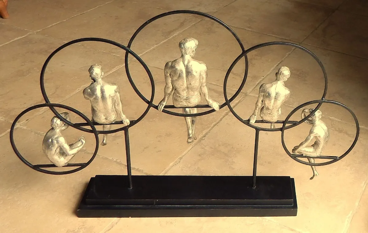 Large Artwork of Male Figurines Inside Metal Rings - Image 3
