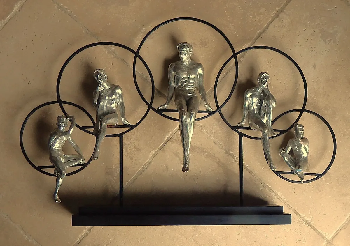 Large Artwork of Male Figurines Inside Metal Rings - Image 4